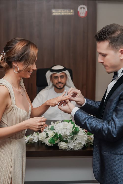 The groom and bride is having court marriage and standing in court room